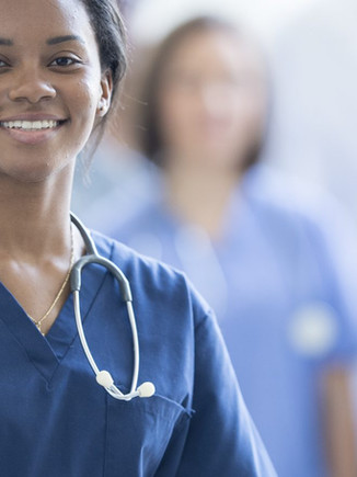 Home health caregiver assisting a senior patient