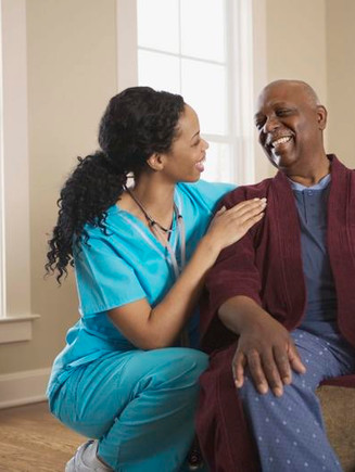 Caregiver supporting a patient at home