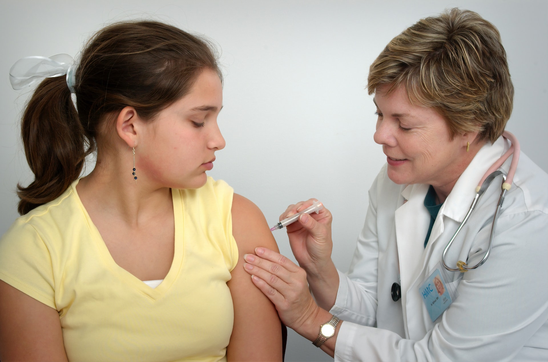 Health care worker assisting a patient